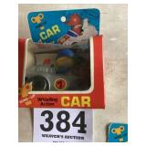 Wind up, whistling action car
