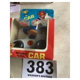 Wind up, whistling action car