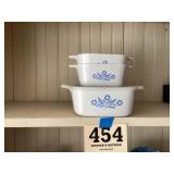 Three pieces of corning ware dishware
