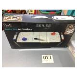 The table top air hockey game