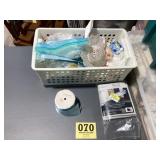 Plastic container full of craft items