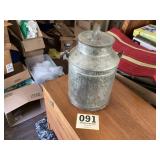 Hand carry milk can with the number 10 marked on