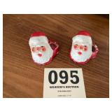 Two early Santa Claus candleholders
