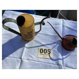 Two small and one unique flower watering cans