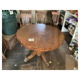 Antique round pedestal table with claw feet, five