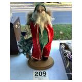 Santa figurine on wood base