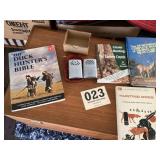 Lot for the hunters, pocket heaters and books