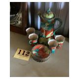 Red and blue floral tea set in an oriental motif