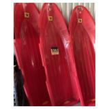 Three plastic toboggans