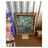 Framed vintage glass medicine bottles