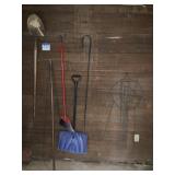 Garden to a lot with shovels plant stands, and