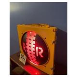 Lighted railroad sign