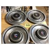 Set a four vintage hubcaps