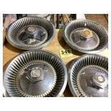 Set a four old Chrysler hubcaps