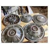 Lots of five vintage hubcaps