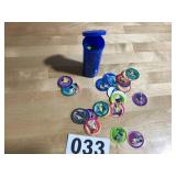 Plastic container full of kids pogs