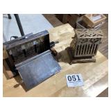 Two old antique metal toasters