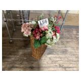 Vintage, tall, wicker basket with artificial