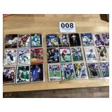 4 sleeves full of NFL football trading cards