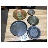 Vintage metal items, pie pans and other items.
