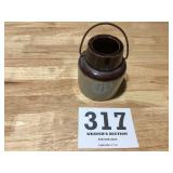 Old well, and tan small fruit jar