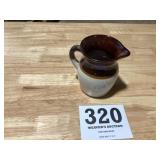 Old small brown and tan milk picture stoneware