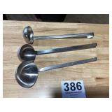 Three stainless steel heavy duty ladles one is