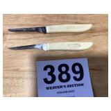 Two vintage pairing knives with advertising for