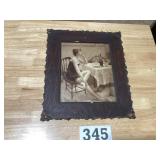 Antique wooden picture frame of a woman in a
