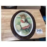 Antique, oval, picture frame with a little girl