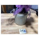 Old 2 gallon brown and tan stoneware jug with a