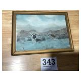 Old picture of two cows standing out in the field