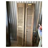 Two 68 inch wooden shutters
