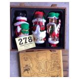 Glass Santas in a wooden box