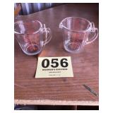Two Pyrex one cup measure