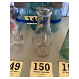Vintage five cent milk bottle