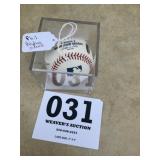 Phil Hughes signed a baseball