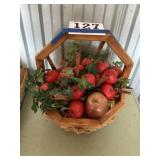 Wooden basket with apples and cinnamon stick