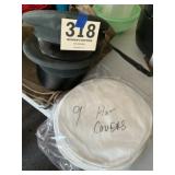 Two military hats with nine hat covers