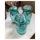 3 Ball jars with glass lids