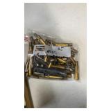 35 Misc empty brass casings. gun traders guide.