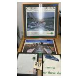 Two framed posters and two picture frames