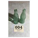 Too old and embossed Coke bottles that are marked