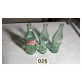 Lot of three larger size glass Coca-Cola bottles