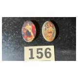 Two vintage metal pill tins with advertising from