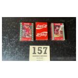 Three decks of playing cards with advertising