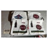 Two advertising Coca-Cola bath towels and wash