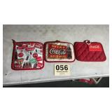 Three collectible Coca-Cola hot pads all look new