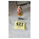 Wind up Tin clown with dancing dog