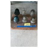 Insulators display on wooden block